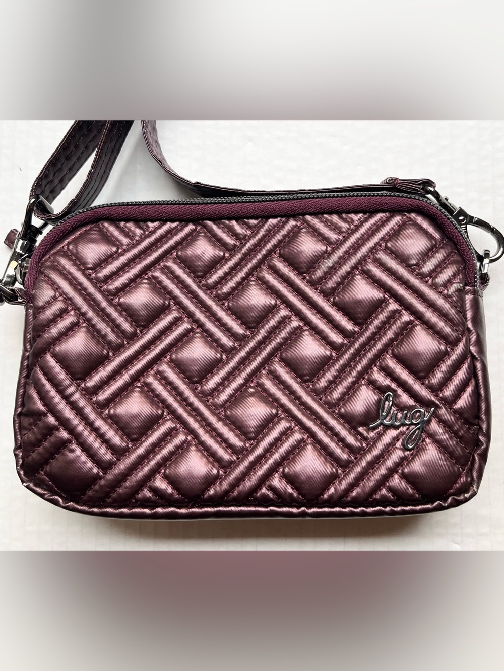 Lug Coupe Convertible Crossbody Bag with Basketweave Pattern in Purple/Plum.